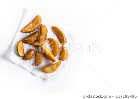 fried potato wedges isolated on white background 117189490
