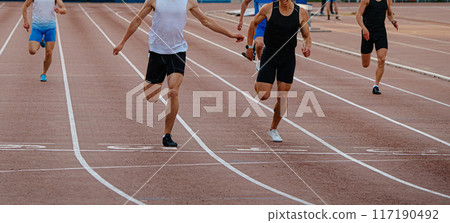 leading runner athlete crosses finish line sprint race leading runner athlete crosses finish line sprint race 117190492