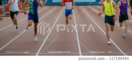 finish line sprint race in stadium, group athletes running together 117190494