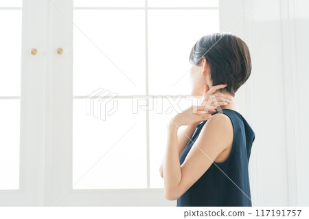 Woman massaging shoulders, stiff shoulders 117191757