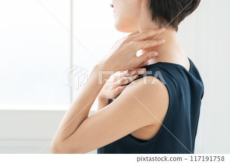 Woman massaging shoulders, stiff shoulders 117191758