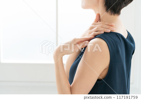 Woman massaging shoulders, stiff shoulders Woman massaging shoulders, stiff shoulders 117191759