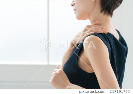 Woman massaging shoulders, stiff shoulders Woman massaging shoulders, stiff shoulders 117191763