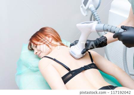 A woman is getting a massage with a man 117192042