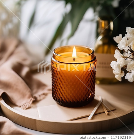 Create a calming ambiance with an amber candle on a tray with matches and decor Create a calming ambiance with an amber candle on a tray with matches and decor 117192319