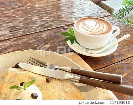 Delicious crepes and cafe latte on the table Delicious crepes and cafe latte on the table 117193618