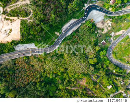 Aerial view of mountain road in forest in summer season, Top view from drone of curve road, Landscape with curved roadway, Beautiful trees Travel asia Phuket Thailand 117194246