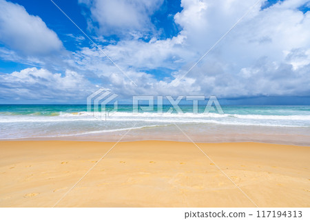Empty tropical beach and seascape, Beautiful sandy beach and sea in sunny day,Blue sky in good weather day, Beach sea space area nature background 117194313