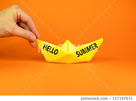 Hello summer symbol. Concept words Hello summer on beautiful yellow paper boat. Beautiful orange paper background. Tourist hand. Business lifestyle Hello summer concept. Copy space. 117197631