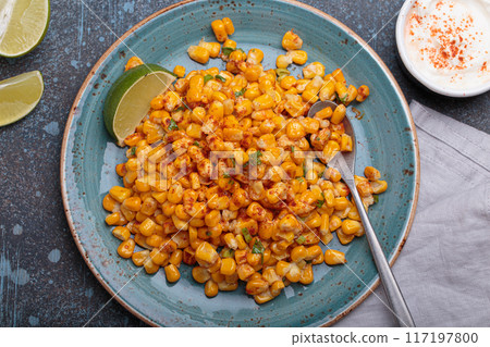 Esquites mexican street corn salad with chili, cilantro and lime juice Esquites mexican street corn salad with chili, cilantro and lime juice 117197800