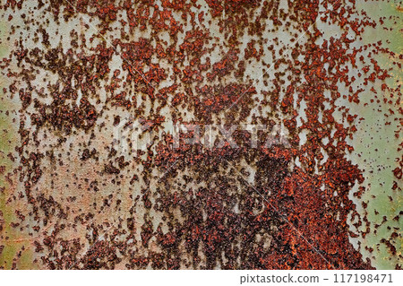 Backdrop of rusty surface of dark, brown, and orange hues. Detailed grunge rusted metal texture. Close-up of rust patterns, aged iron, scratched, worn, distressed areas, decay, corrosion details 117198471