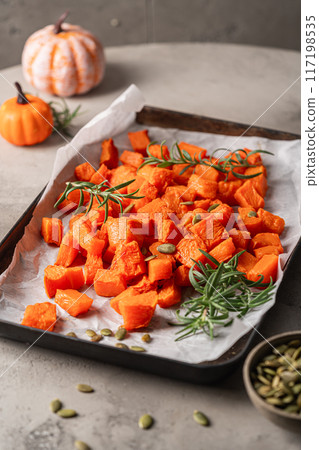 Oven baked pumpkin slices 117198535