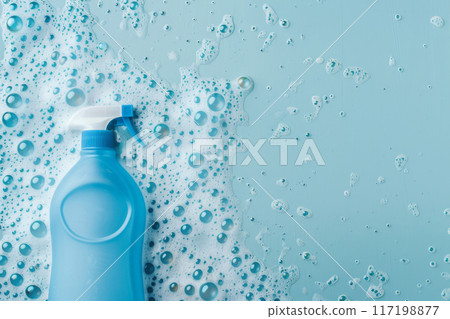 Cleaning spray bottle in soapy lather background with copy space 117198877
