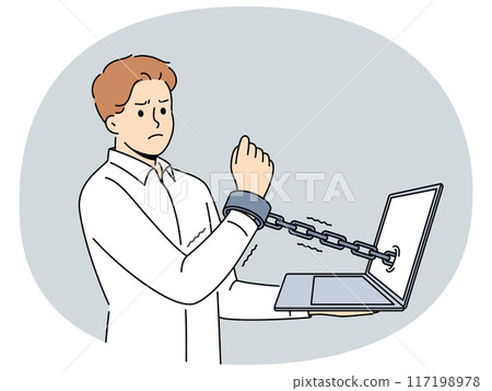 Man handcuffed to laptop symbolizes slavery of clerks and freelancers working through internet 117198978