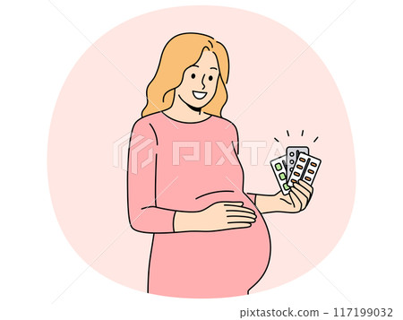Pregnant woman holds blisters of pills and vitamins to support immunity of baby in womb 117199032