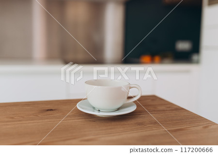 Empty ceramic mug mockup product display with blurry kitchen background. 117200666