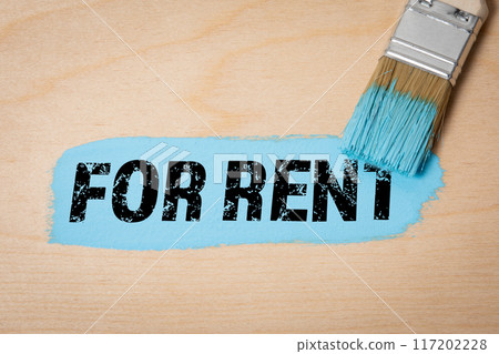 For Rent Concept. Blue paint and paint brush on wooden texture background 117202228