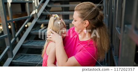 Funny child with cochlear implant walks outdoor. Banner copy space. Hearing aid and medicine innovating technology concept. Diversity and inclusion. 117202357