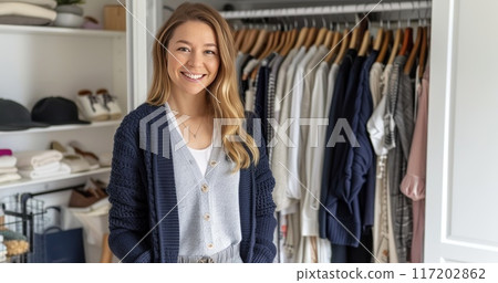 Woman and wardrobe furniture at home. Female clothes in closet. Fashion collection in wear shelf. Room interior and modern storage 117202862