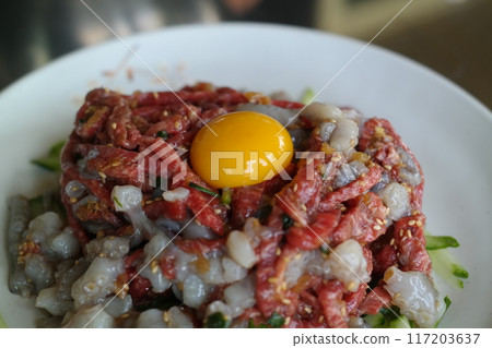 Chopped live octopus and beef tartare Chopped live octopus and beef tartare 117203637