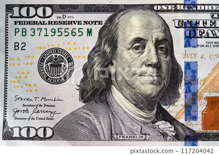 Close-up one hundred US dollar bill, top view point Close-up one hundred US dollar bill, top view point 117204042