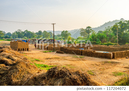 Traditional wood fired brick kiln in a village Traditional wood fired brick kiln in a village 117204072