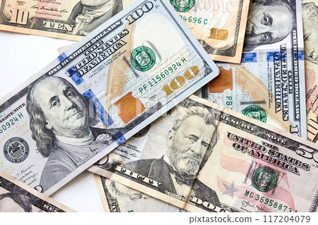 Background of various US dollar bills, top view point Background of various US dollar bills, top view point 117204079