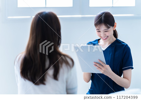 Female staff providing counseling at a beauty clinic Female staff providing counseling at a beauty clinic 117204399