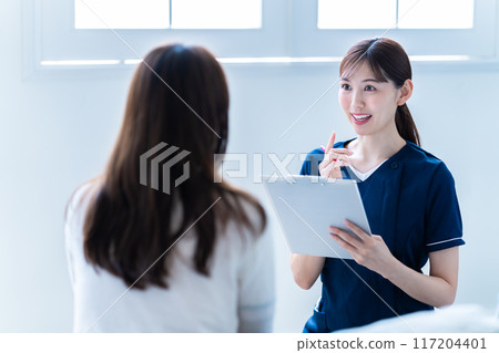 Female staff providing counseling at a beauty clinic Female staff providing counseling at a beauty clinic 117204401