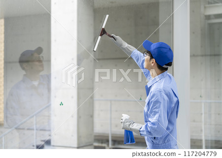 cleaning staff cleaning windows 117204779