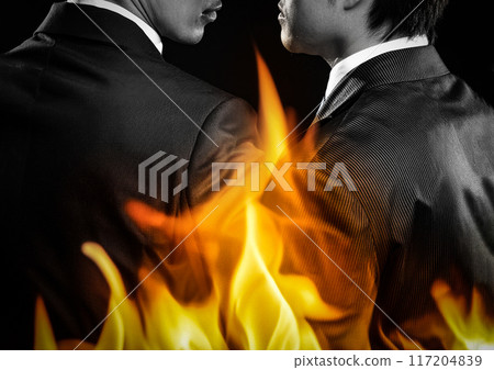 Composite image of confrontational businessmen and flames Composite image of confrontational businessmen and flames 117204839