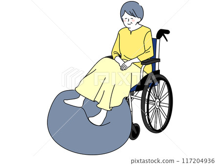 Senior woman in a wheelchair doing rehabilitation with a balance ball Senior woman in a wheelchair doing rehabilitation with a balance ball 117204936