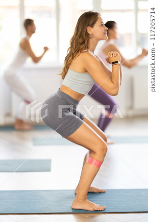 Training leg muscles and using expanders in Pilates classes for people of different ages and nationalities 117205714