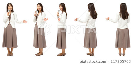 Full-body cutout of a female presenter holding a microphone 117205763