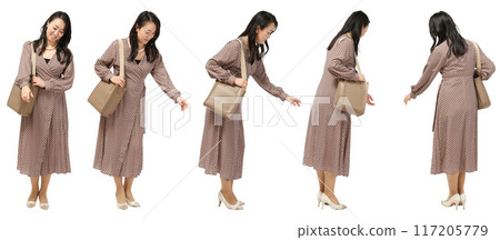 Full-body cutout of a woman touching products while shopping Full-body cutout of a woman touching products while shopping 117205779