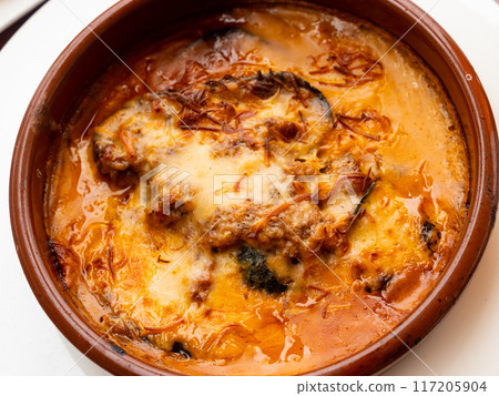 Greek moussaka from baked eggplant, tomato, minced lamb meat 117205904