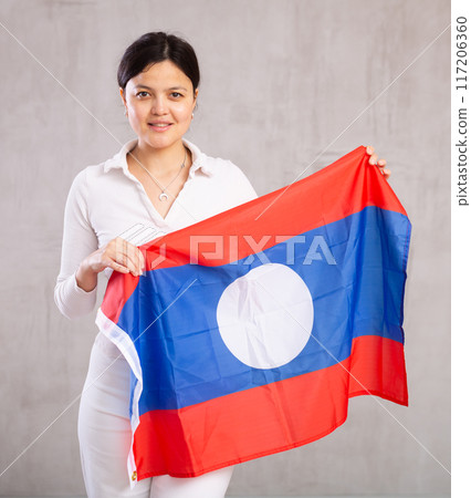 Young woman posing in studio with Laos flag Young woman posing in studio with Laos flag 117206360