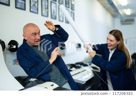 Engineer and office worker have fun in printing house 117206383
