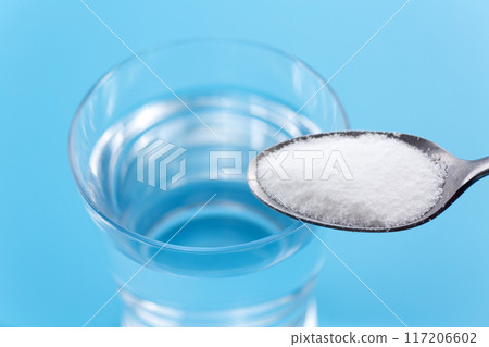 Rehydration powder and a glass of water 117206602