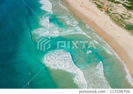 Coastline and ocean with waves on sunny day in Brazil. Aerial view of Morro das Pedras, Florianopolis Coastline and ocean with waves on sunny day in Brazil. Aerial view of Morro das Pedras, Florianopolis 117206708