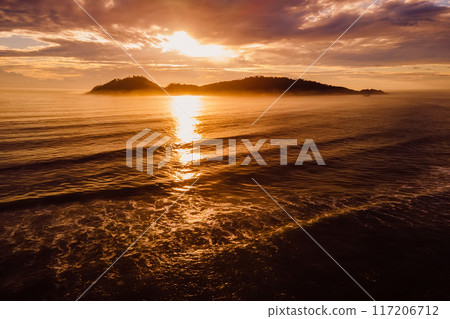 Sunrise and silhouette of Campeche island in Florianopolis, Brazil 117206712