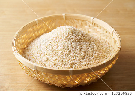 Germinated rice in a colander 117206856