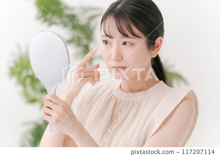 A woman suffering from eye problems 117207114