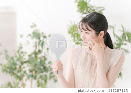 A woman suffering from eye problems 117207115