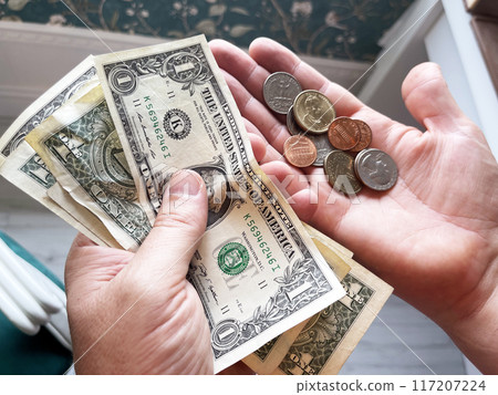 USA banknotes money hold by hand 117207224