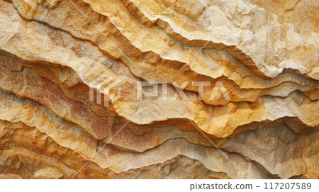 A close up of a rock wall with a texture resembling a mountain 117207589