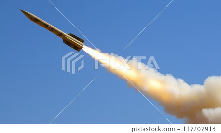 Kowsar Missile MidFlight with Smoke Trail Against Clear Blue Sky, Iranian Military Technology, HighSpeed Rocket Propulsion 117207913