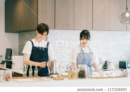 Young staff working in a cafe Young staff working in a cafe 117208895
