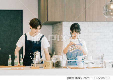 Young staff working in a cafe 117208902