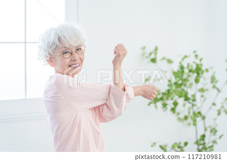 Senior woman stretching Senior woman stretching 117210981